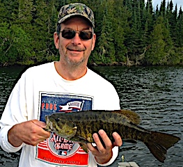 Mike with Another Trophy Smallmouth Bass Fishing at Fireside Lodge in Canada